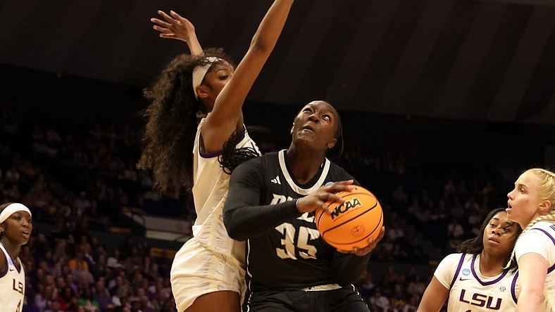 Mar 22, 2024; Baton Rouge, Louisiana, USA; LSU Lady Tigers forward Angel Reese (10) blocks the shot attempt by Rice Owls center Sussy Ngulefac (35) during the first half at Pete Maravich Assembly Center. Mandatory Credit: Stephen Lew-USA TODAY Sports