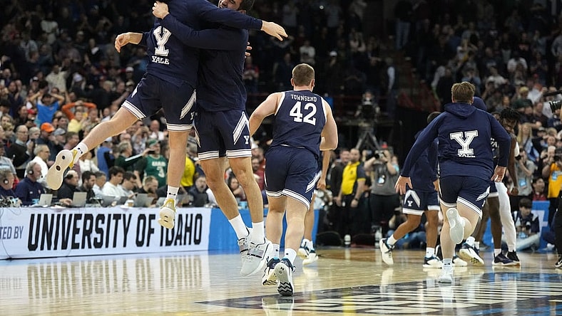 Mar 22, 2024; Spokane, WA, USA; Yale Bulldogs guard Trevor Mullin (0) celebrates with guard Emir Buyukhanli (11) after a game against the Auburn Tigers in the first round of the 2024 NCAA Tournament at Spokane Veterans Memorial Arena. Mandatory Credit: Kirby Lee-USA TODAY Sports