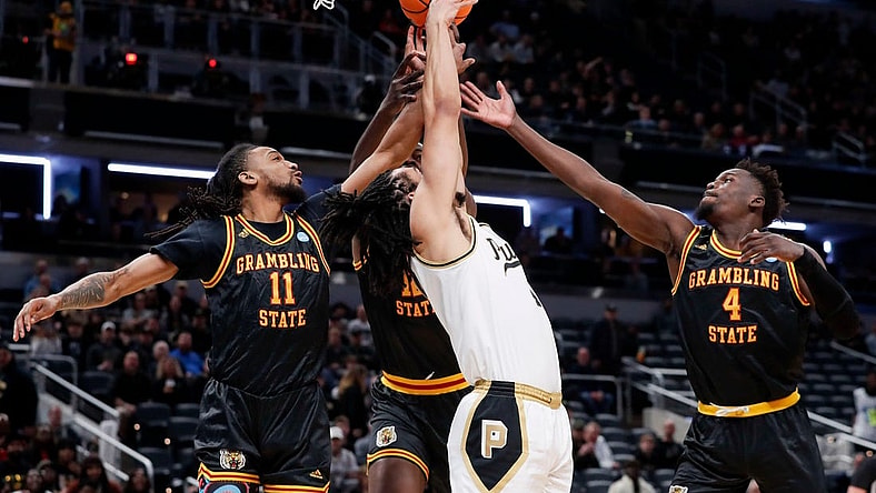 Purdue Boilermakers forward Trey Kaufman-Renn (4) goes up to fight for a rebound with Grambling State Tigers guard Jourdan Smith (11), Grambling State Tigers forward Jonathan Aku (12) and Grambling State Tigers forward Antwan Burnett (4) on Friday, March 22, 2024, during the first round of the NCAA Men’s Basketball Tournament at Gainbridge Fieldhouse in Indianapolis.