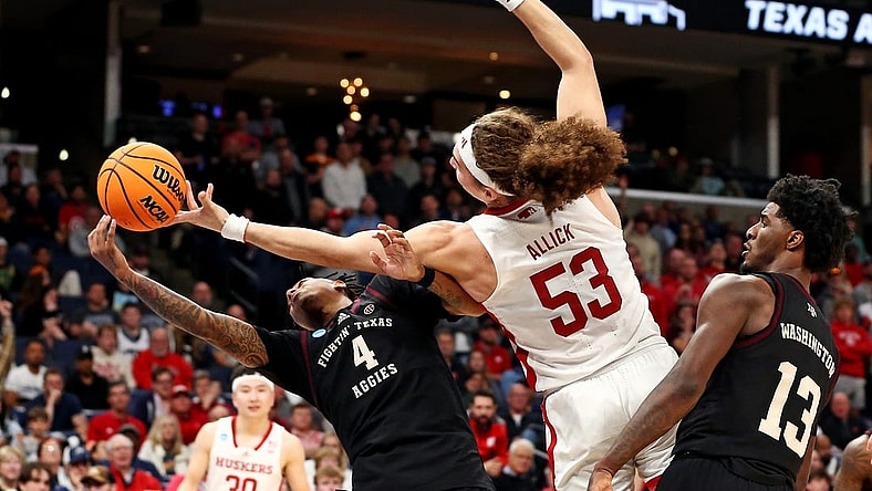 Mar 22, 2024; Memphis, TN, USA;  Texas A&M Aggies guard Wade Taylor IV (4) and Nebraska Cornhuskers forward Josiah Allick (53) go for the ball during the second half in the first round of the 2024 NCAA Tournament at FedExForum. Mandatory Credit: Petre Thomas-USA TODAY Sports