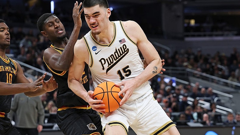 Mar 22, 2024; Indianapolis, IN, USA; Purdue Boilermakers center Zach Edey (15) makes a basket as Grambling State Tigers forward Malik Lamin (32) defends during the second half in the first round of the 2024 NCAA Tournament at Gainbridge FieldHouse. Mandatory Credit: Trevor Ruszkowski-USA TODAY Sports