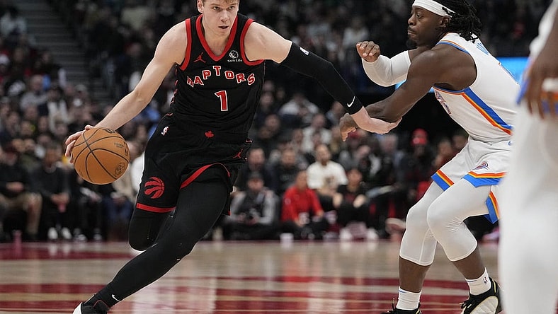 Mar 22, 2024; Toronto, Ontario, CAN; Toronto Raptors guard Gradey Dick (1) drives to the net against Oklahoma City Thunder forward Jalen Williams (8) during the second half at Scotiabank Arena. Mandatory Credit: John E. Sokolowski-USA TODAY Sports