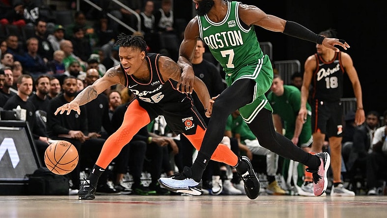 Mar 22, 2024; Detroit, Michigan, USA; Detroit Pistons guard Marcus Sasser (25) loses control of his dribble while being defended by Boston Celtics guard Jaylen Brown (7) in the third quarter at Little Caesars Arena. Mandatory Credit: Lon Horwedel-USA TODAY Sports