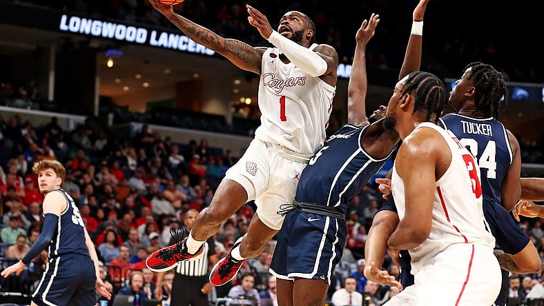 Mar 22, 2024; Memphis, TN, USA;  Houston Cougars guard Jamal Shead (1) shoots the ball against Longwood Lancers guard Johnathan Massie (5) during the first half in the first round of the 2024 NCAA Tournament at FedExForum. Mandatory Credit: Petre Thomas-USA TODAY Sports