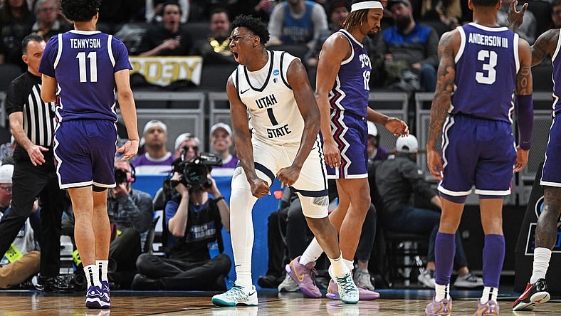 Mar 22, 2024; Indianapolis, IN, USA; Utah State Aggies forward Great Osobor (1) reacts after a play during the first half against the TCU Horned Frogs in the first round of the 2024 NCAA Tournament at Gainbridge FieldHouse. Mandatory Credit: Robert Goddin-USA TODAY Sports