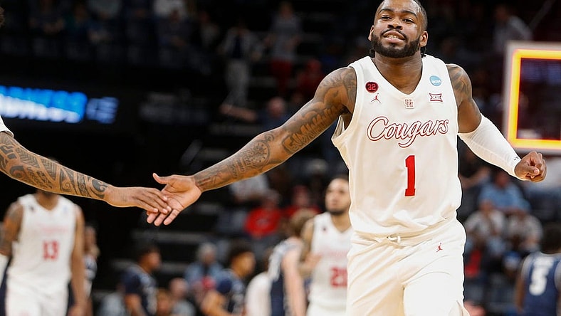 Houston's Jamal Shead (1) high-fives a teammate as he runs off the court while Houston leads at the end of the first half during the first round game between University of Houston and Longwood University in the 2024 NCAA Tournament at FedExForum in Memphis, Tenn., on Friday, March 22, 2024.