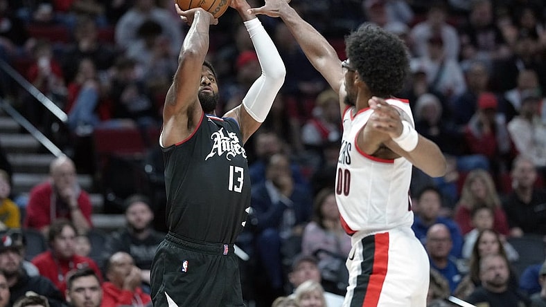 Mar 22, 2024; Portland, Oregon, USA; LA Clippers forward Paul George (13) shoots the ball over Portland Trail Blazers guard Scoot Henderson (00) during the second half at Moda Center. Mandatory Credit: Soobum Im-USA TODAY Sports