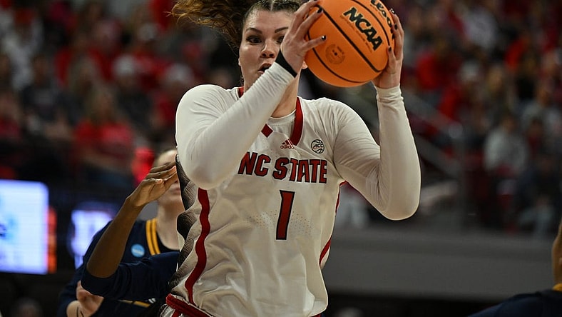 Mar 23, 2024; Raleigh, North Carolina, USA; NC State Wolfpack center River Baldwin (1) grabs a rebound in the first round of the 2024 NCAA Women's Tournament at James T. Valvano Arena at William Neal Reynolds. Mandatory Credit: William Howard-USA TODAY Sports