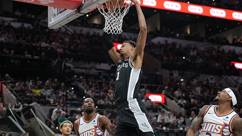 Mar 23, 2024; San Antonio, Texas, USA;  San Antonio Spurs center Victor Wembanyama (1) dunks the ball in front of Phoenix Suns forward Kevin Durant (35) and guard Bradley Beal (3) in the first half at Frost Bank Center. Mandatory Credit: Daniel Dunn-USA TODAY Sports