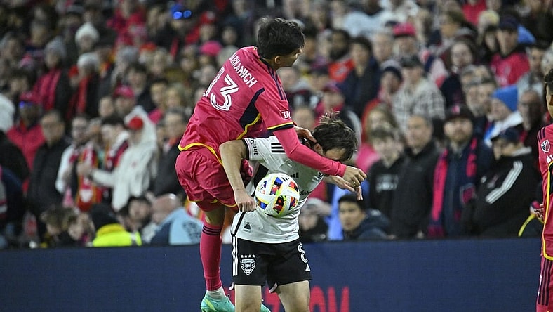 Mar 23, 2024; St. Louis, Missouri, USA; St. Louis CITY SC defender Anthony Markanich (13) challenges D.C. United midfielder Jared Stroud (8) for the ball during the second half at CITYPARK. Mandatory Credit: Scott Rovak-USA TODAY Sports