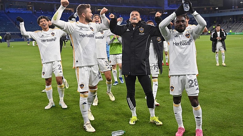 Mar 23, 2024; Kansas City, Kansas, USA; Members of the LA Galaxy celebrate after defeating Sporting Kansas City at Children's Mercy Park. Mandatory Credit: Peter Aiken-USA TODAY Sports