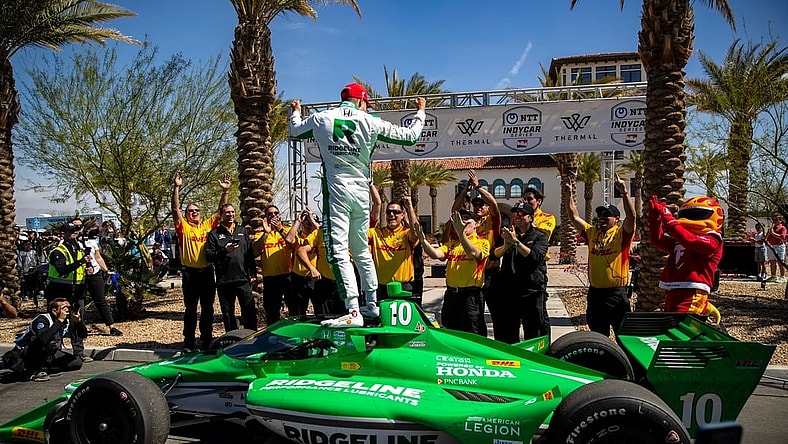 Alex Palou of Chip Ganassi Racing celebrates winning the feature race of the $1 Million Challenge with his team at The Thermal Club in Thermal, Calif., Sunday, March 24, 2024.