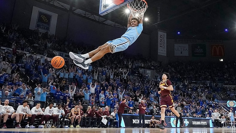 Indiana State Sycamores guard Julian Larry (1) dunks the ball Sunday, March 24, 2024, during the second round of the NIT at the Hulman Center in Terre Haute. The Indiana State Sycamores defeated the Minnesota Golden Gophers, 76-64.