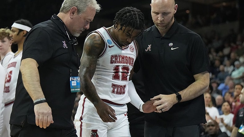 Mar 24, 2024; Spokane, WA, USA; Alabama Crimson Tide guard Latrell Wrightsell Jr. (12) is attended to by official in the first half against the Grand Canyon Antelopes at Spokane Veterans Memorial Arena. Mandatory Credit: Kirby Lee-USA TODAY Sports