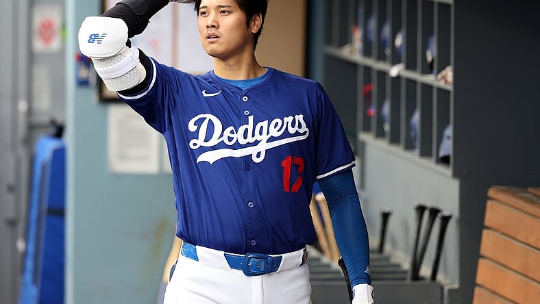 Mar 24, 2024; Los Angeles, California, USA;  Los Angeles Dodgers designated hitter Shohei Ohtani (17) in the dugout prior to the game against the Los Angeles Angels at Dodger Stadium. Mandatory Credit: Kiyoshi Mio-USA TODAY Sports