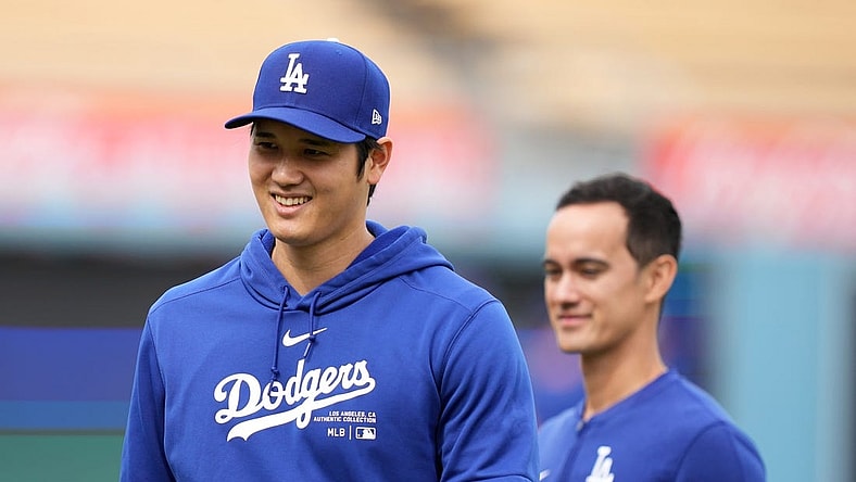 Mar 25, 2024; Los Angeles, California, USA; Los Angeles Dodgers designated hitter Shohei Ohtani (left) and interpreter Will Ireton before the game against the Los Angeles Angels at Dodger Stadium. Mandatory Credit: Kirby Lee-USA TODAY Sports