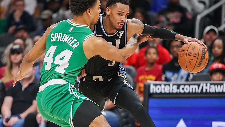 Mar 25, 2024; Atlanta, Georgia, USA; Boston Celtics guard Jaden Springer (44) defends Atlanta Hawks guard Dejounte Murray (5) in the second half at State Farm Arena. Mandatory Credit: Brett Davis-USA TODAY Sports