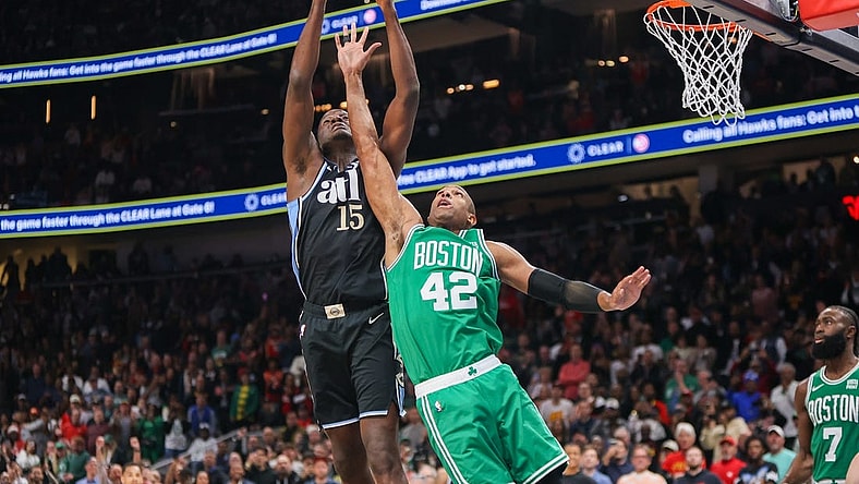 Mar 25, 2024; Atlanta, Georgia, USA; Atlanta Hawks center Clint Capela (15) grabs a rebound over Boston Celtics center Al Horford (42) in the second half at State Farm Arena. Mandatory Credit: Brett Davis-USA TODAY Sports