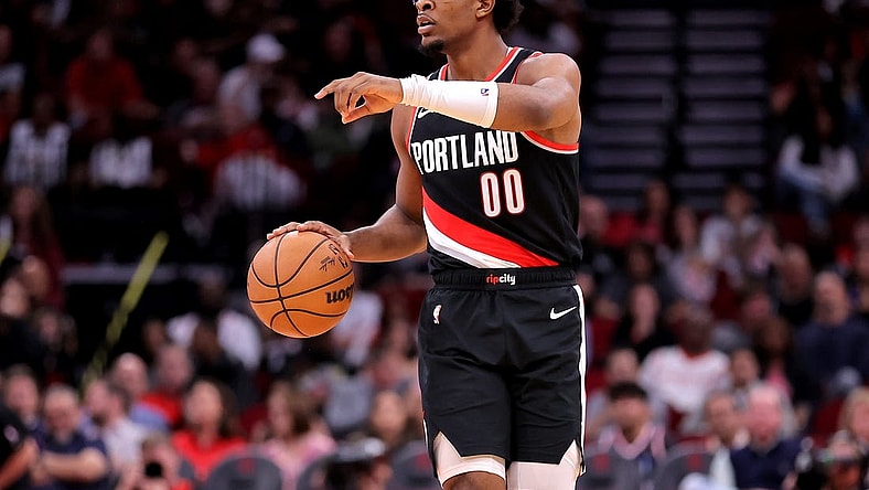 Mar 25, 2024; Houston, Texas, USA; Portland Trail Blazers guard Scoot Henderson (00) handles the ball against the Houston Rockets during the fourth quarter at Toyota Center. Mandatory Credit: Erik Williams-USA TODAY Sports