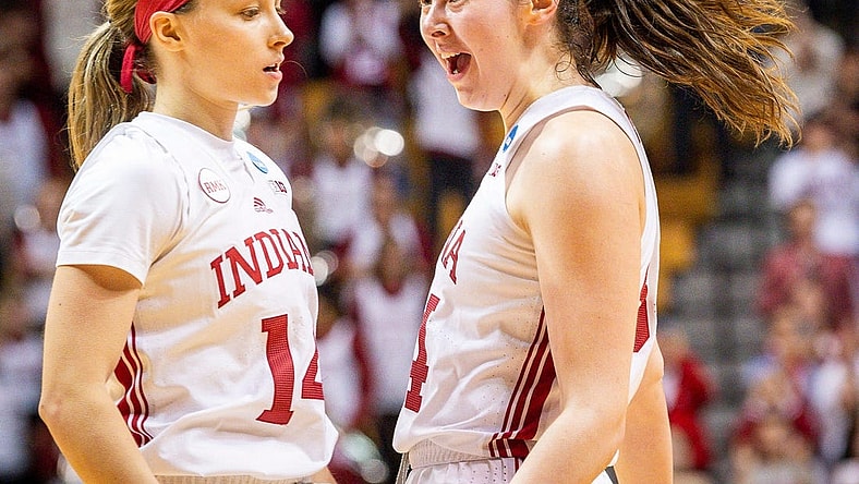 Indiana's Mackenzie Holmes (54) celebrates with Sara Scalia (14) after the fourth quarter during second round NCAA action at Simon Skjodt Assembly Hall on Monday, March 25, 2024.