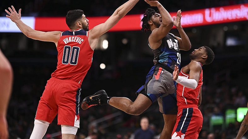 Mar 27, 2024; Washington, District of Columbia, USA;  Washington Wizards forward Tristan Vukcevic (00) blocks Brooklyn Nets guard Cam Thomas (24) shot during the first half at Capital One Arena. Mandatory Credit: Tommy Gilligan-USA TODAY Sports