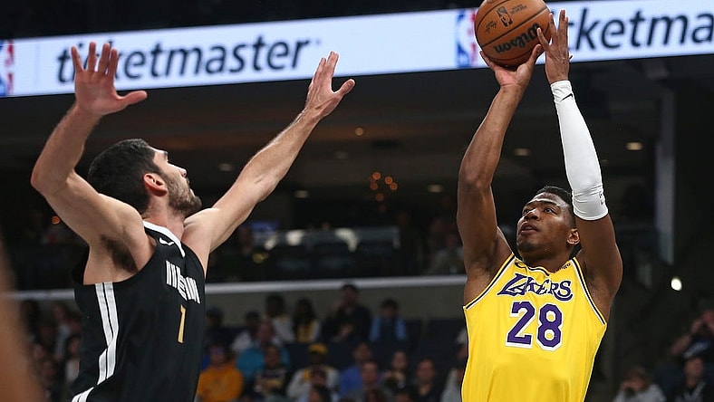Mar 27, 2024; Memphis, Tennessee, USA; Los Angeles Lakers forward Rui Hachimura (28) shoots as Memphis Grizzlies forward-center Santi Aldama (7) defends during the first half at FedExForum. Mandatory Credit: Petre Thomas-USA TODAY Sports