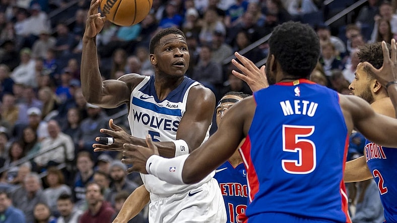 Mar 27, 2024; Minneapolis, Minnesota, USA; Minnesota Timberwolves guard Anthony Edwards (5) drives towards the basket and passes the ball against the Detroit Pistons in the first half at Target Center. Mandatory Credit: Jesse Johnson-USA TODAY Sports