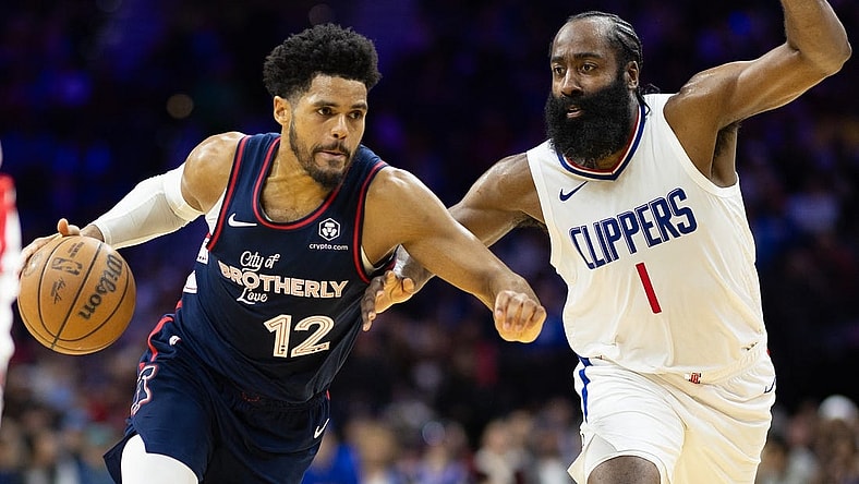 Mar 27, 2024; Philadelphia, Pennsylvania, USA; Philadelphia 76ers forward Tobias Harris (12) dribbles the ball against LA Clippers guard James Harden (1) during the second quarter at Wells Fargo Center. Mandatory Credit: Bill Streicher-USA TODAY Sports