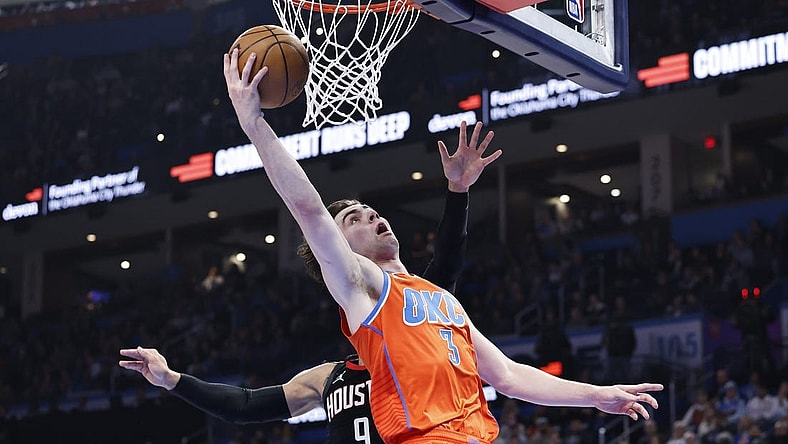 Mar 27, 2024; Oklahoma City, Oklahoma, USA; Oklahoma City Thunder guard Josh Giddey (3) shoots in front of Houston Rockets forward Dillon Brooks (9) during the second quarter at Paycom Center. Mandatory Credit: Alonzo Adams-USA TODAY Sports