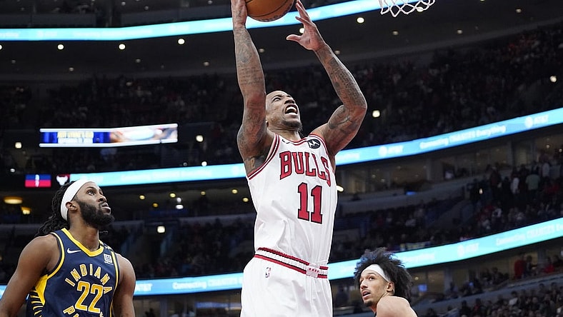 Mar 27, 2024; Chicago, Illinois, USA; Chicago Bulls forward DeMar DeRozan (11) is defended by Indiana Pacers forward Isaiah Jackson (22) during the second half at United Center. Mandatory Credit: David Banks-USA TODAY Sports