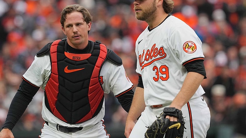 Mar 28, 2024; Baltimore, Maryland, USA; Baltimore Orioles pitcher Corbin Burnes (39) is greeted by catcher Adley Rutschman (35) after the second inning against the Los Angeles Angels at Oriole Park at Camden Yards. Mandatory Credit: Mitch Stringer-USA TODAY Sports