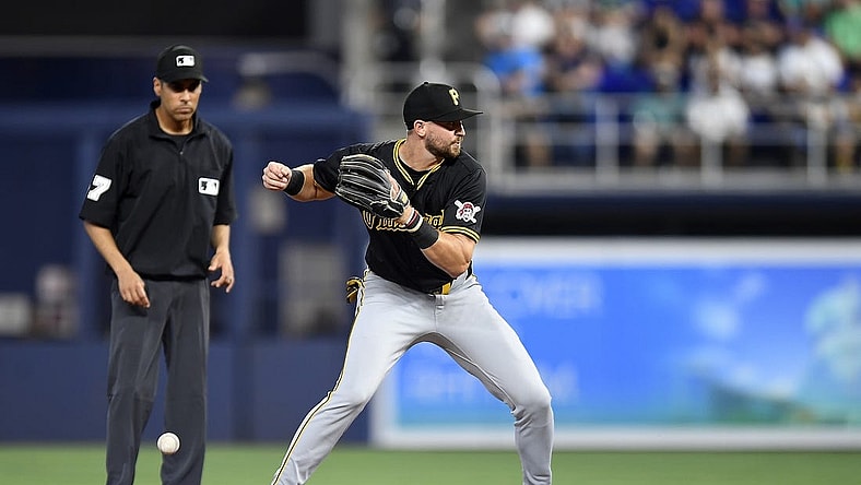 Mar 28, 2024; Miami, Florida, USA;  Pittsburgh Pirates second baseman Jared Triolo drops the ball while trying to turn a double play during the second inning against the Miami Marlins, at loanDepot Park. Mandatory Credit: Michael Laughlin-USA TODAY Sports