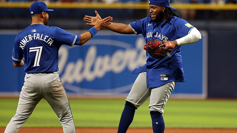 Mar 28, 2024; St. Petersburg, Florida, USA;Toronto Blue Jays first baseman Vladimir Guerrero Jr. (27) and first baseman Vladimir Guerrero Jr. (27) celebrates after they beat the Tampa Bay Rays at Tropicana Field. Mandatory Credit: Kim Klement Neitzel-USA TODAY Sports