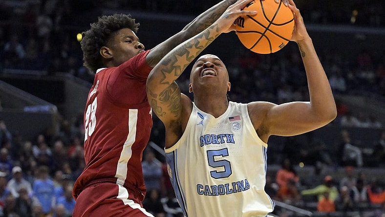 Mar 28, 2024; Los Angeles, CA, USA; Alabama Crimson Tide forward Nick Pringle (23) defends against North Carolina Tar Heels forward Armando Bacot (5) in the first half in the semifinals of the West Regional of the 2024 NCAA Tournament at Crypto.com Arena. Mandatory Credit: Jayne Kamin-Oncea-USA TODAY Sports