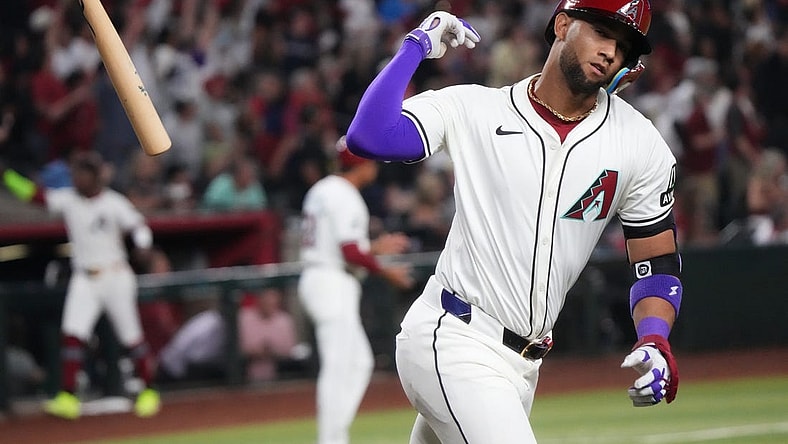 Arizona Diamondbacks Lourdes Gurriel Jr. (12) flips his bat after hitting a 2-run home run against the Colorado Rockies on Opening Day at Chase Field.