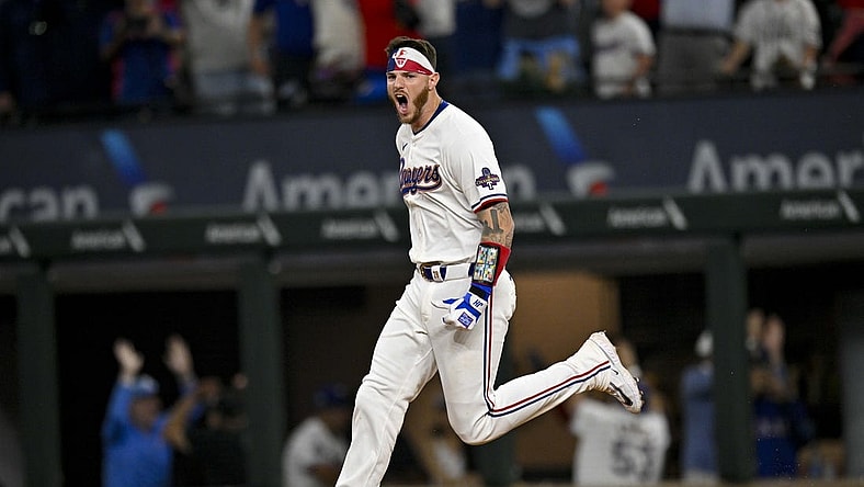 Mar 28, 2024; Arlington, Texas, USA; Texas Rangers catcher Jonah Heim (28) celebrates after he hits a walk off single against the Chicago Cubs during the tenth inning at Globe Life Field. Mandatory Credit: Jerome Miron-USA TODAY Sports