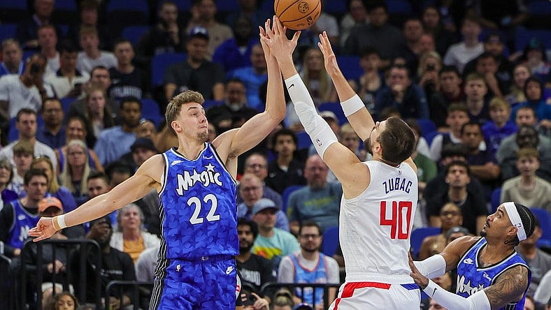 Mar 29, 2024; Orlando, Florida, USA; Orlando Magic forward Franz Wagner (22) and LA Clippers center Ivica Zubac (40) jump for the rebound during the first quarter at KIA Center. Mandatory Credit: Mike Watters-USA TODAY Sports