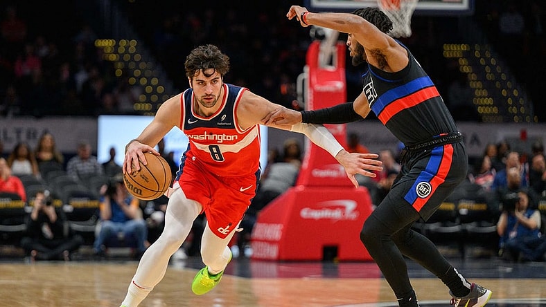 Mar 29, 2024; Washington, District of Columbia, USA; Washington Wizards forward Deni Avdija (8) drives to the basket against Detroit Pistons forward Troy Brown Jr. (7) at Capital One Arena. Mandatory Credit: Reggie Hildred-USA TODAY Sports
