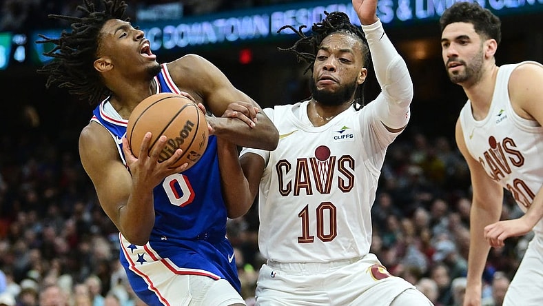 Mar 29, 2024; Cleveland, Ohio, USA; Philadelphia 76ers guard Tyrese Maxey (0) drives to the basket against Cleveland Cavaliers guard Darius Garland (10) during the first half at Rocket Mortgage FieldHouse. Mandatory Credit: Ken Blaze-USA TODAY Sports