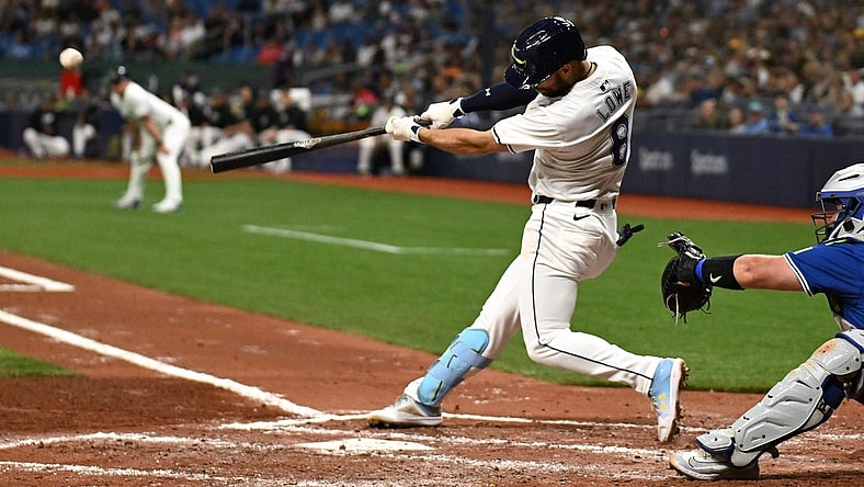 Mar 29, 2024; St. Petersburg, Florida, USA; Tampa Bay Rays second baseman Brandon Lowe (8) hits a grand slam in the third inning of the game against the Toronto Blue Jays  at Tropicana Field. Mandatory Credit: Jonathan Dyer-USA TODAY Sports