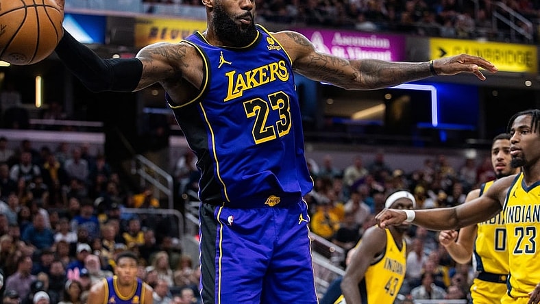 Mar 29, 2024; Indianapolis, Indiana, USA; Los Angeles Lakers forward LeBron James (23) passes the ball  in the second half against the Indiana Pacers at Gainbridge Fieldhouse. Mandatory Credit: Trevor Ruszkowski-USA TODAY Sports