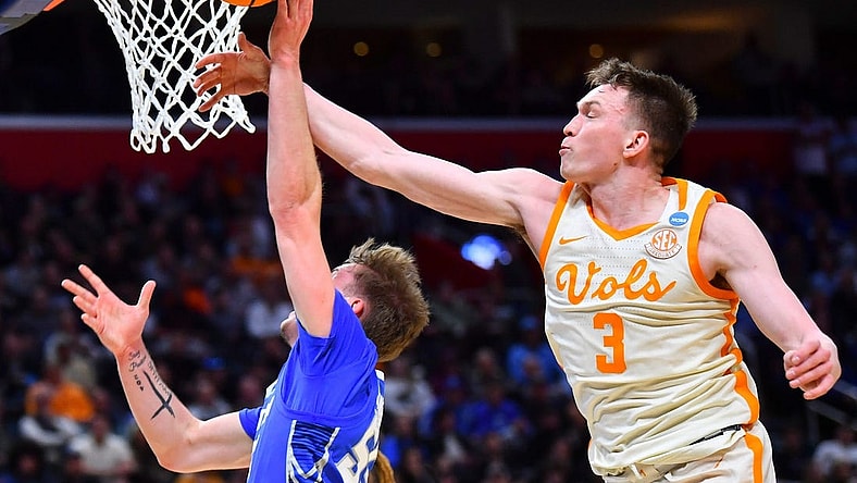 Tennessee guard Dalton Knecht (3) blocks Creighton guard Baylor Scheierman (55) during a NCAA Tournament Sweet 16 game between Tennessee and Creighton held at Little Caesars Arena in Detroit on Friday, March 29, 2024.
