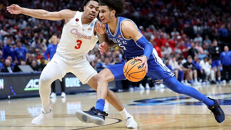 Mar 29, 2024; Dallas, TX, USA; Duke Blue Devils guard Tyrese Proctor (5) drives against Houston Cougars guard Ramon Walker Jr. (3) during the first half in the semifinals of the South Regional of the 2024 NCAA Tournament at American Airlines Center. Mandatory Credit: Kevin Jairaj-USA TODAY Sports