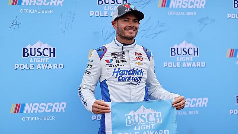 Mar 30, 2024; Richmond, Virginia, USA; NASCAR Cup Series driver Kyle Larson (5) celebrates within the pole after qualifying for the Toyota Owners 400 at Richmond Raceway. Mandatory Credit: Peter Casey-USA TODAY Sports