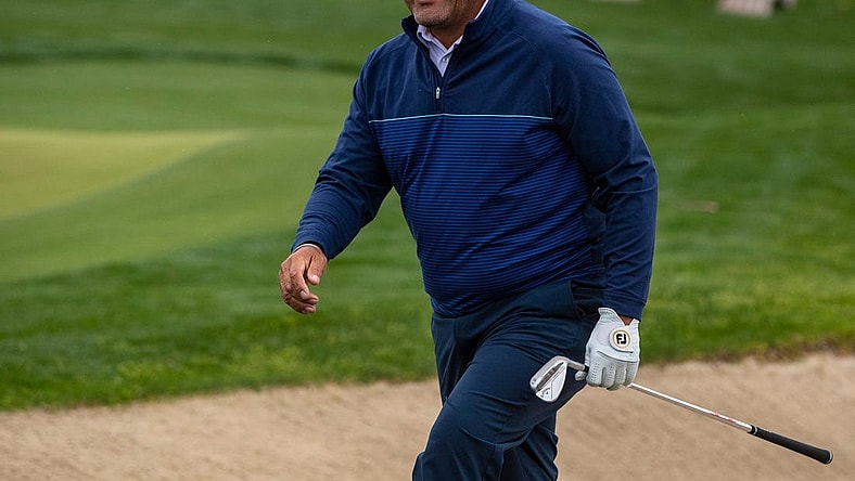 Ricardo Gonzalez smiles at his caddie and son, Santiago, after hitting out of a bunker and onto the green on 17 during the second round of The Galleri Classic at Mission Hills Country Club in Rancho Mirage, Calif., Saturday, March 30, 2024.
