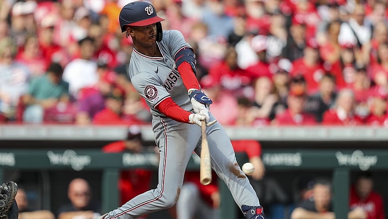 Mar 30, 2024; Cincinnati, Ohio, USA; Washington Nationals third baseman Trey Lipscomb (38) hits a single against the Cincinnati Reds in the third inning at Great American Ball Park. Mandatory Credit: Katie Stratman-USA TODAY Sports