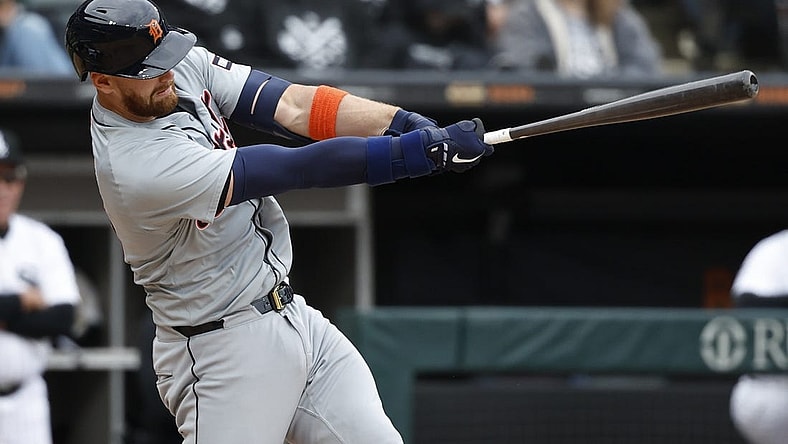 Mar 30, 2024; Chicago, Illinois, USA; Detroit Tigers catcher Carson Kelly (15) hits an RBI-single against the Chicago White Sox during the 10th inning at Guaranteed Rate Field. Mandatory Credit: Kamil Krzaczynski-USA TODAY Sports