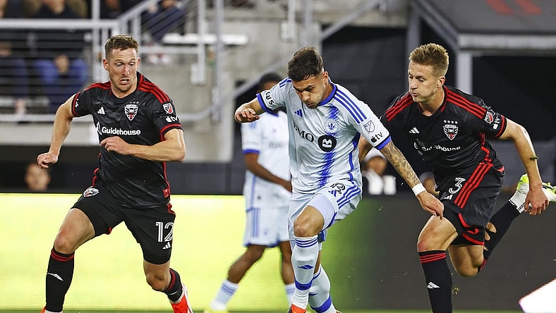 Mar 30, 2024; Washington, District of Columbia, USA; CF Montreal midfielder Dominic Iankov (8) runs with the ball as D.C. United defender Conner Antley (12) and D.C. United defender Lucas Bartlett (3) defend during the first half an at Audi Field. Mandatory Credit: Amber Searls-USA TODAY Sports