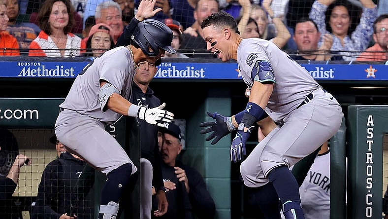 Mar 30, 2024; Houston, Texas, USA; New York Yankees third baseman Oswaldo Cabrera (95) celebrates with New York Yankees designated hitter Aaron Judge (99, right) after hitting a two-run home run to right field against the Houston Astros during the seventh inning at Minute Maid Park. Mandatory Credit: Erik Williams-USA TODAY Sports