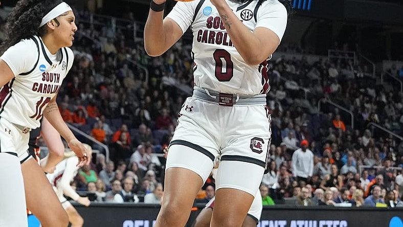 Mar 31, 2024; Albany, NY, USA; South Carolina Gamecocks guard Te-Hina Paopao (0) grabs a rebound against the Oregon State Beavers during the first half in the finals of the Albany Regional of the 2024 NCAA Tournament at MVP Arena. Mandatory Credit: Gregory Fisher-USA TODAY Sports